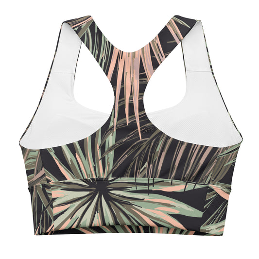 back close up of the chiswick Longline performance bra.A women's sports bra with a tropical palm leaf print in black, sage green, and peach, featuring contrasting solid white underwire cups.