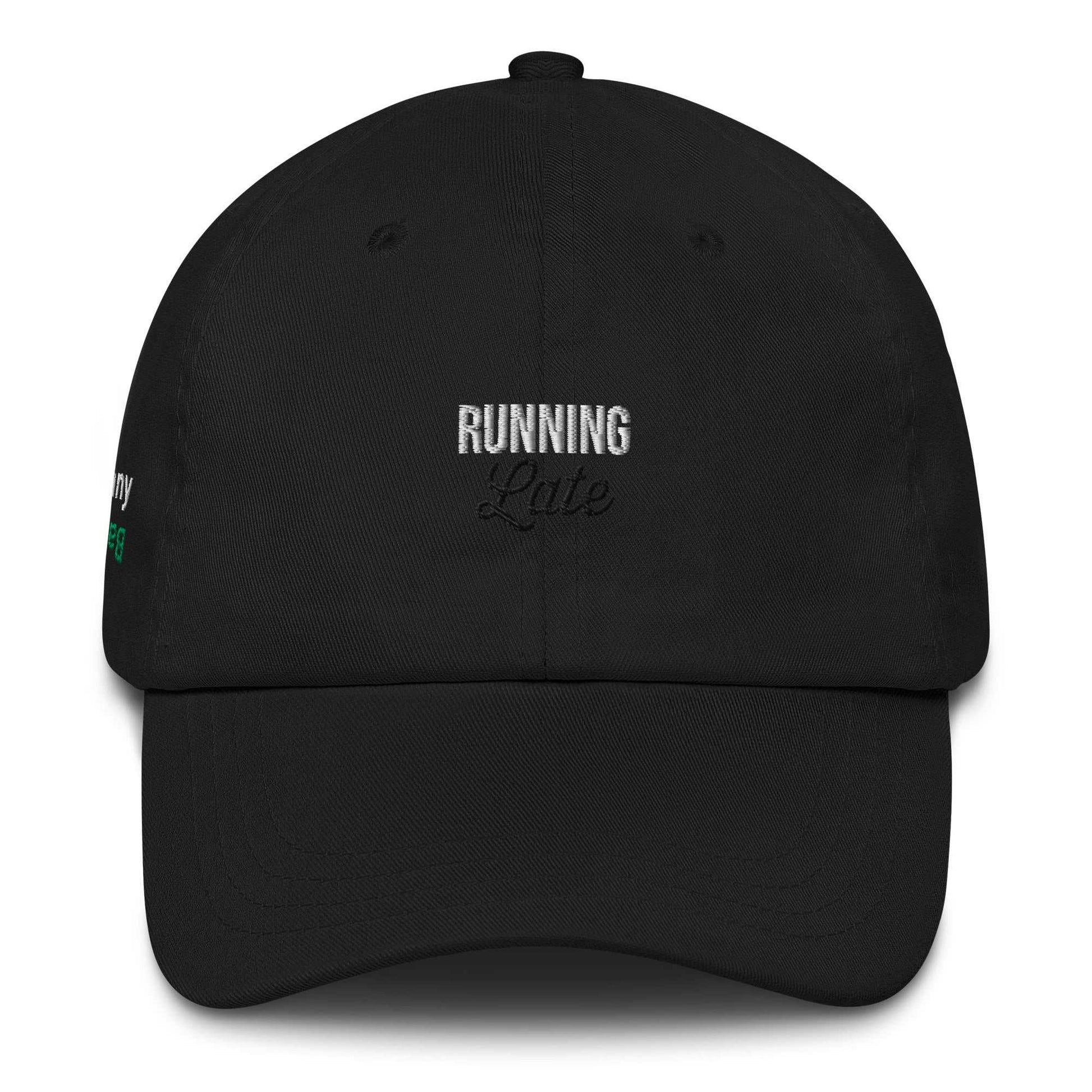 A close up of The Running Late Cap in pink showing the running late text embroidered in white and black