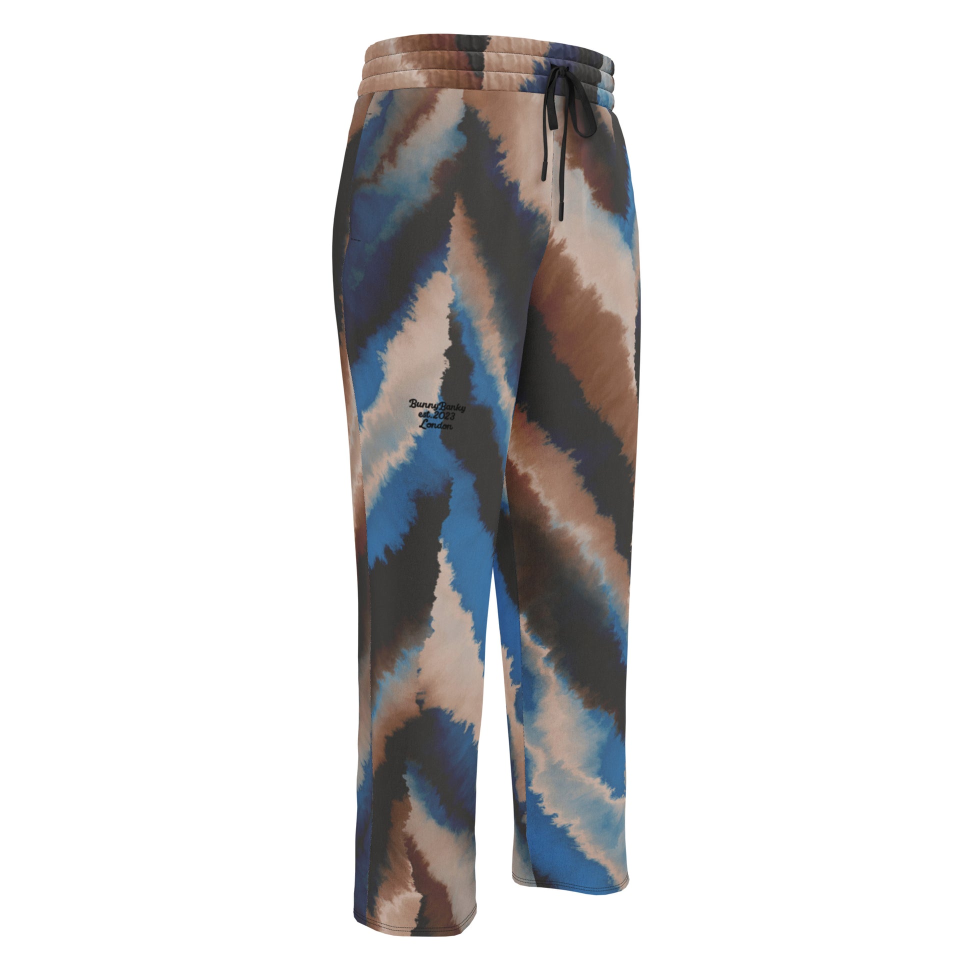 The Côte d'Azur Flow Joggers featuring an abstract blue, beige, and brown brushstroke print on a wide-leg relaxed silhouette.