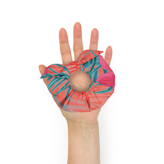 disrtrict tropic scrunchie with a removable bow made from certified recycled polyester in vibrant tropic print in orange and turquoise hues