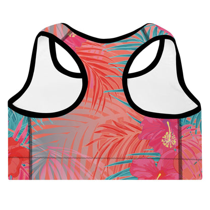 Close-up of the District Tropics Performance Bra. The image showcases the vibrant pink and blue floral pattern, the supportive racerback design, and the premium mesh lining details.