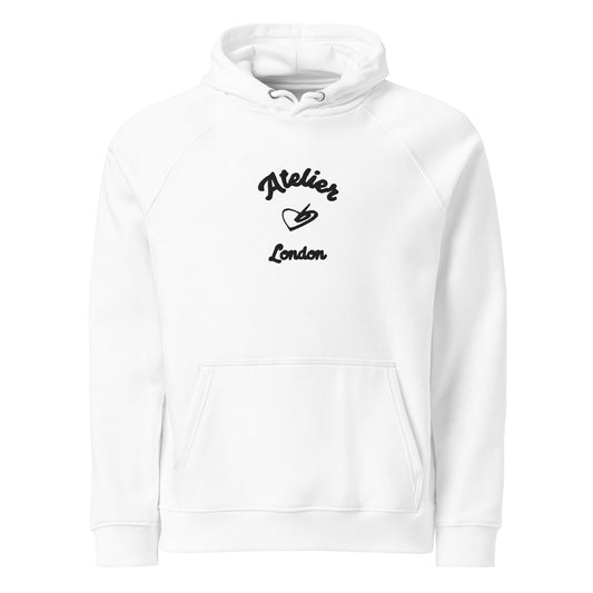 A close up of The Atelier Hoodie showing the branded atelier heart logo