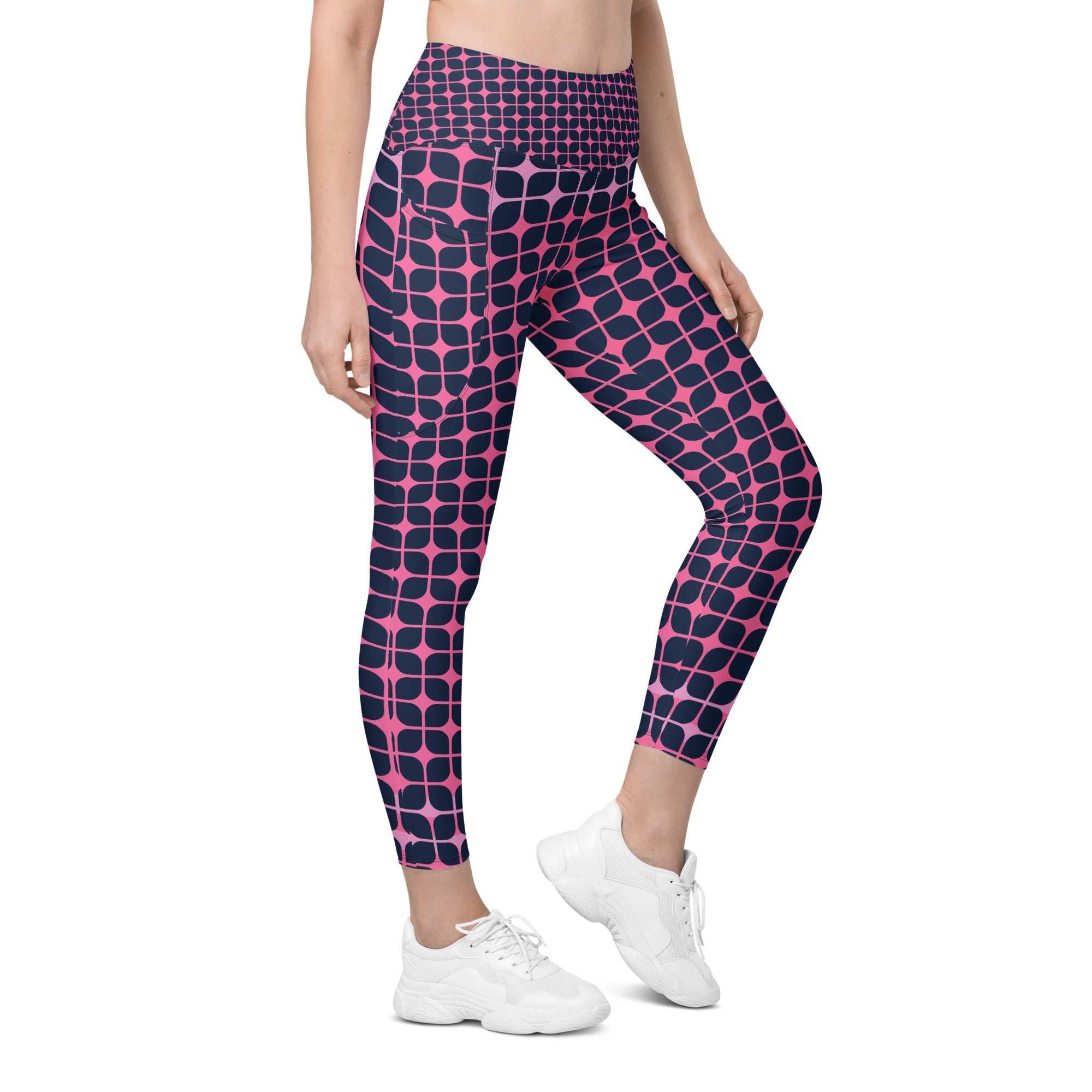A model wearing The Embankment Sculpt Leggings, showing the sculpting fit and the navy and fuchsia geometric print.