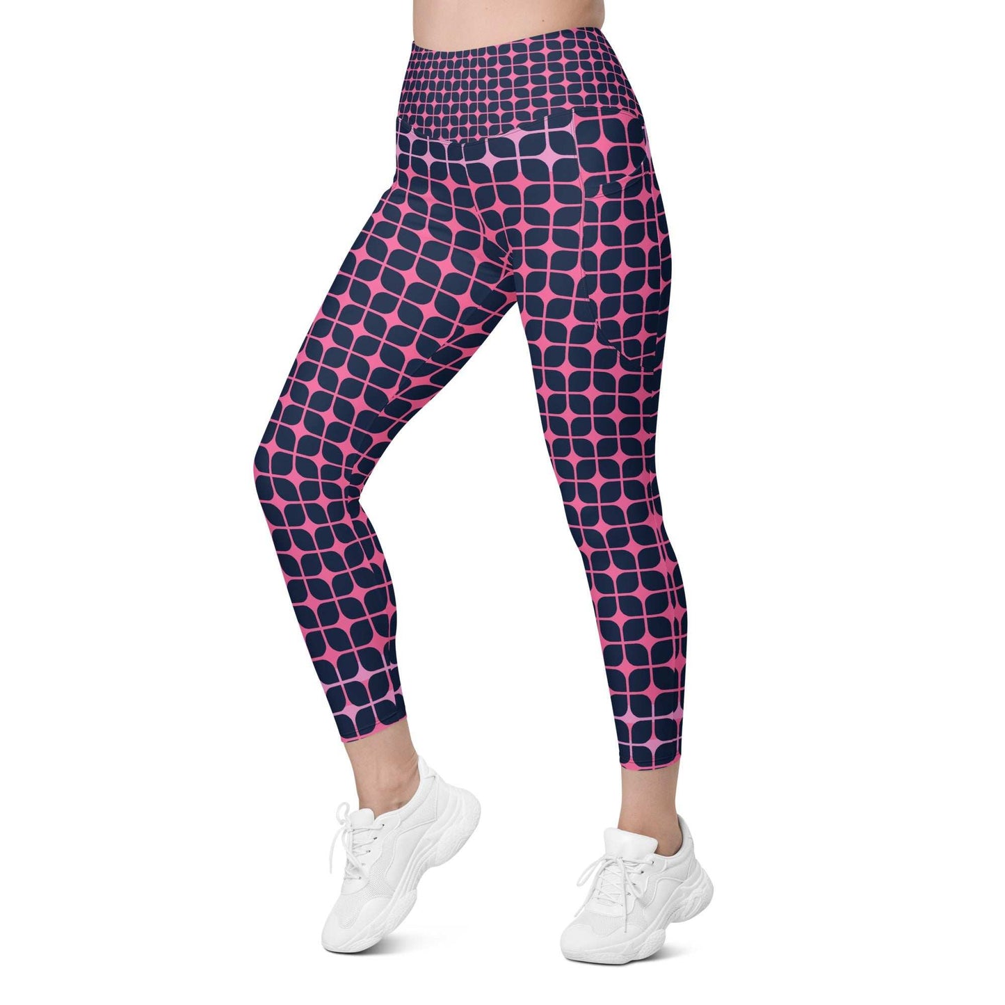 A model wearing The Embankment Sculpt Leggings, showing the sculpting fit and the navy and fuchsia geometric print.