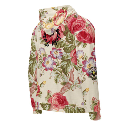 A close up of the Evergreen Zip Hoodie, showcasing the elaborate red rose and green vine vintage print on a sustainable cream fabric.
