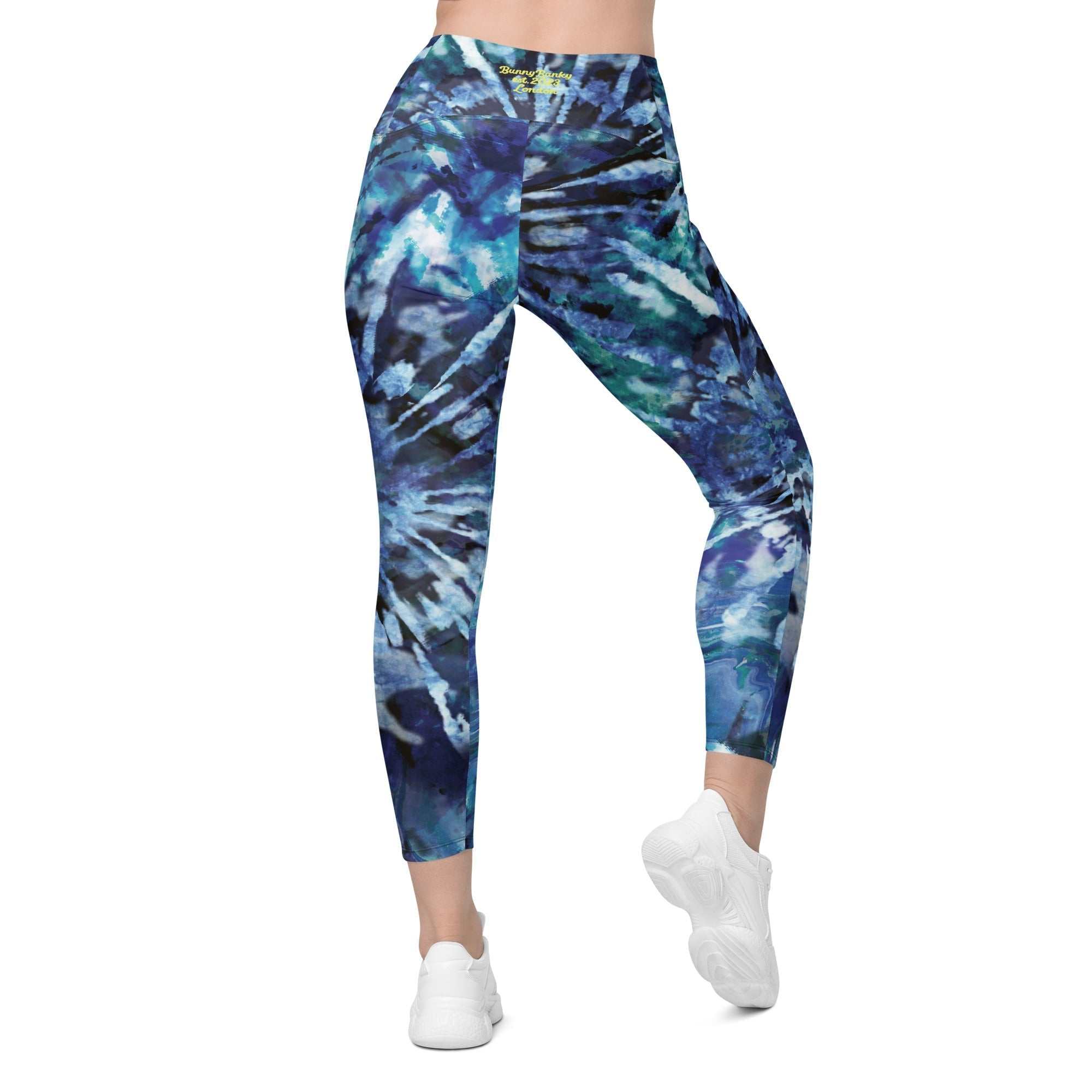 Blue patterned high-waisted leggings with side pockets and soft stretchy fabric