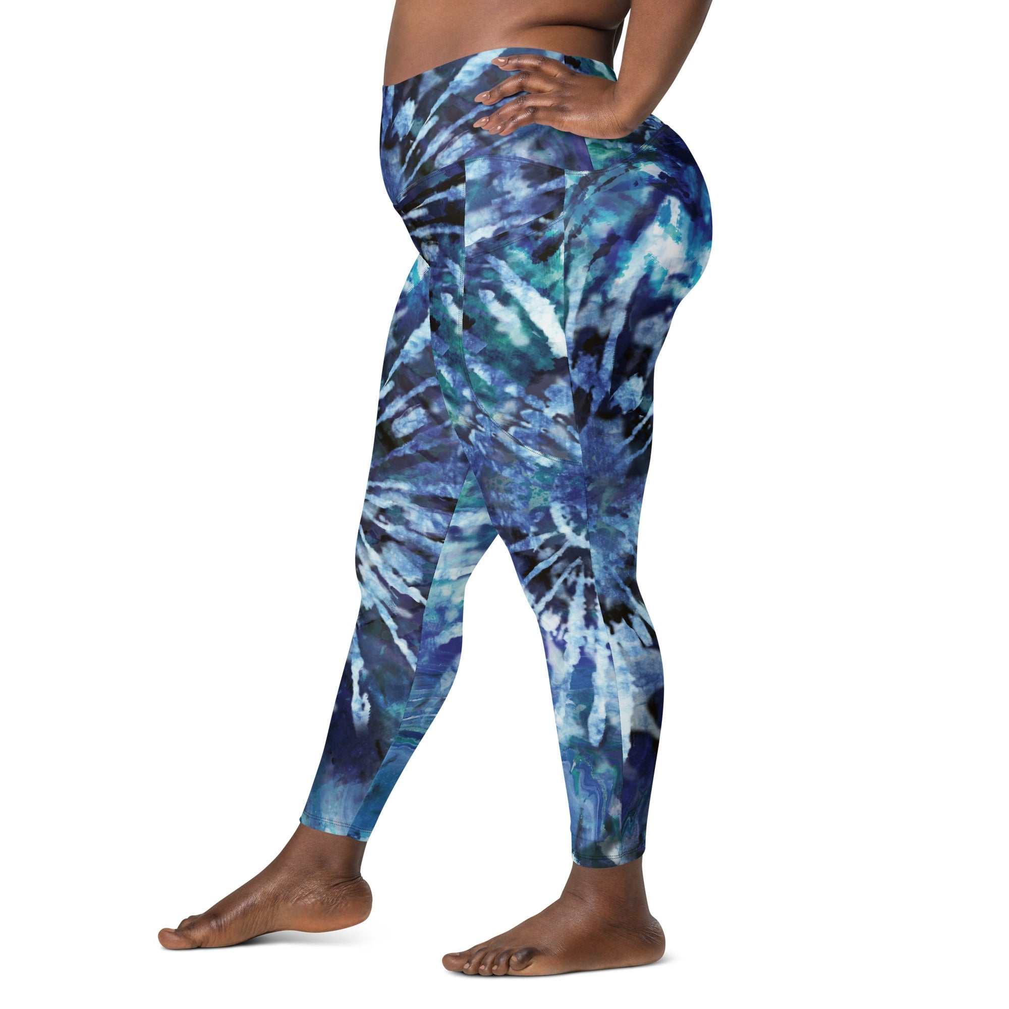 High-waisted blue and black tie-dye leggings with side pockets and tight fit for workouts and casual wear