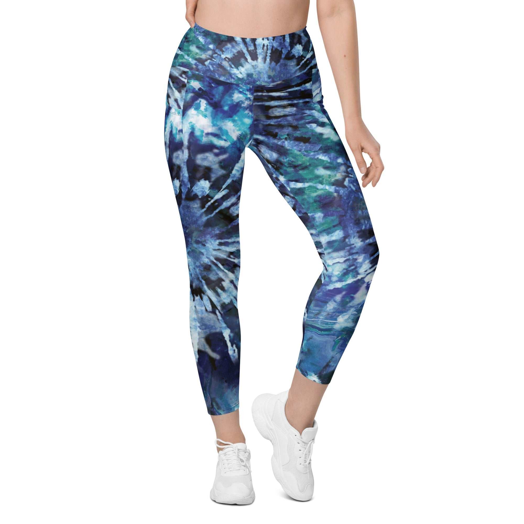 High-waisted blue and green tie-dye leggings with side pockets and tight fit for workouts and casual wear