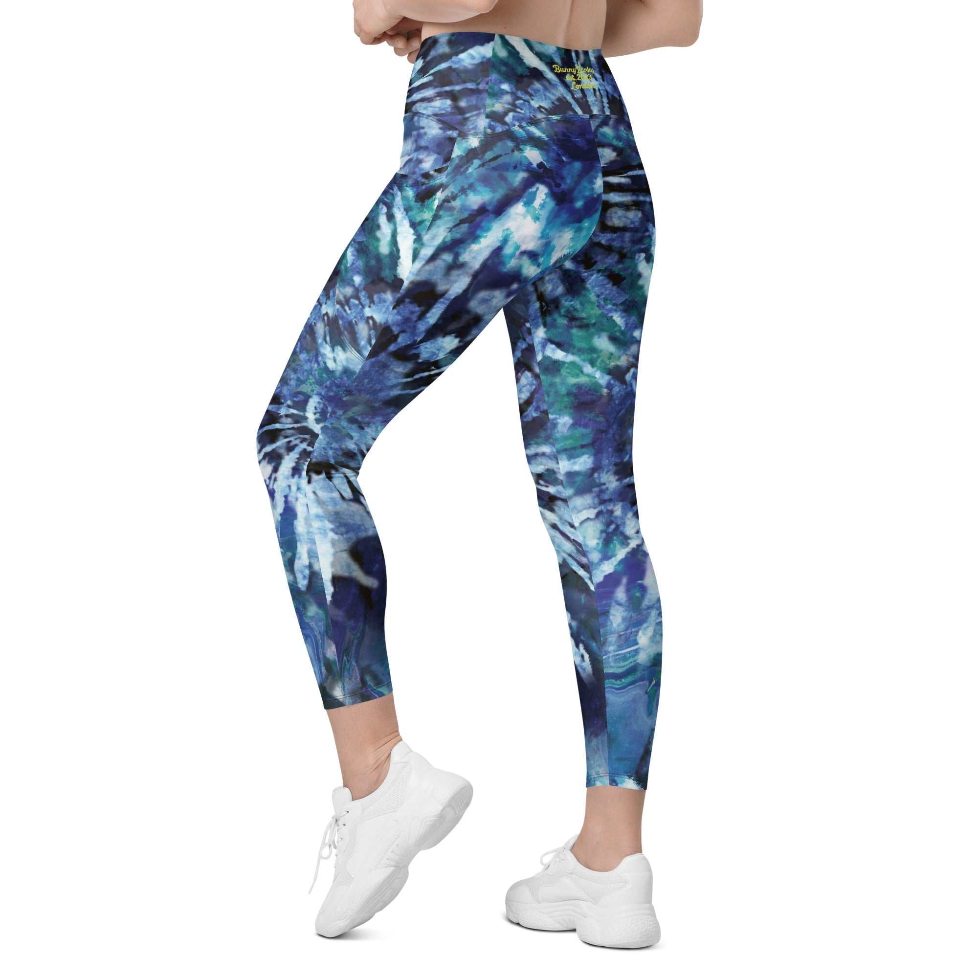 High-waisted blue patterned leggings with side pockets and tight fit for workouts and casual wear