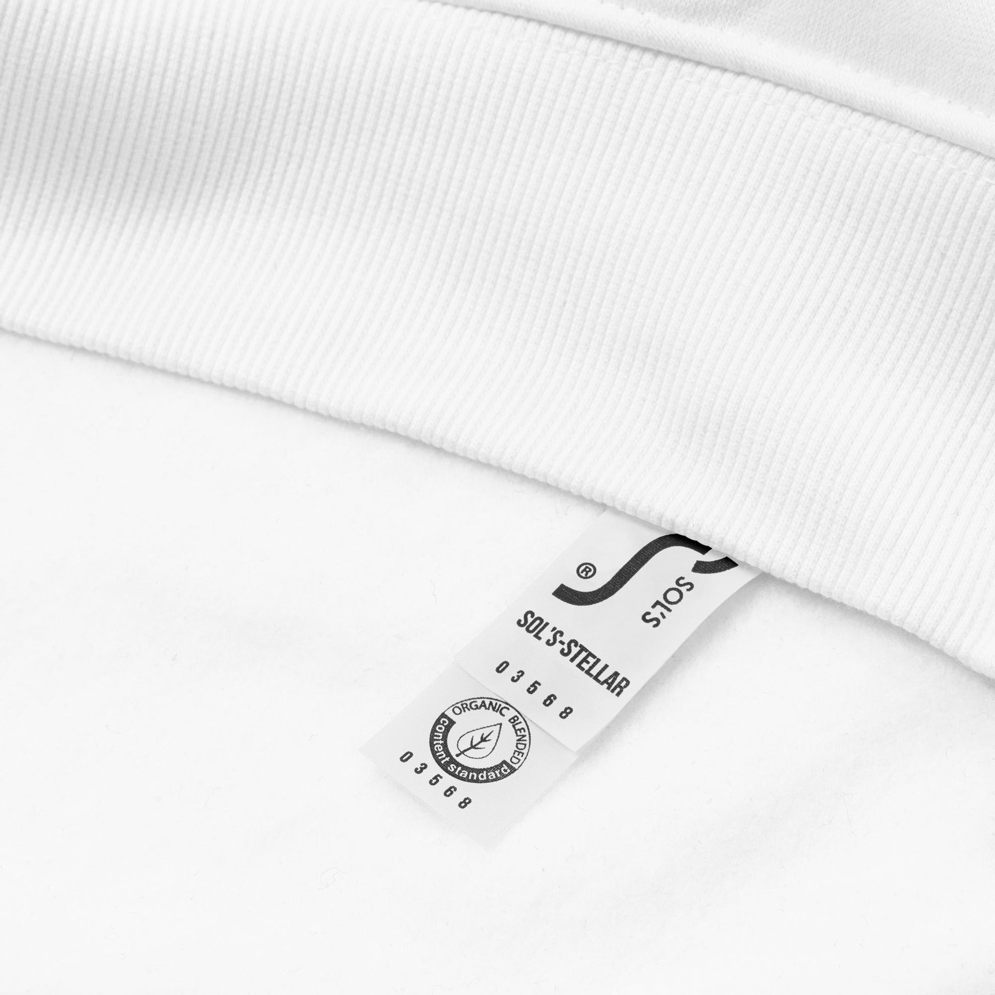 A close-up of The Geneva Visionary Hoodie certified cotton tag