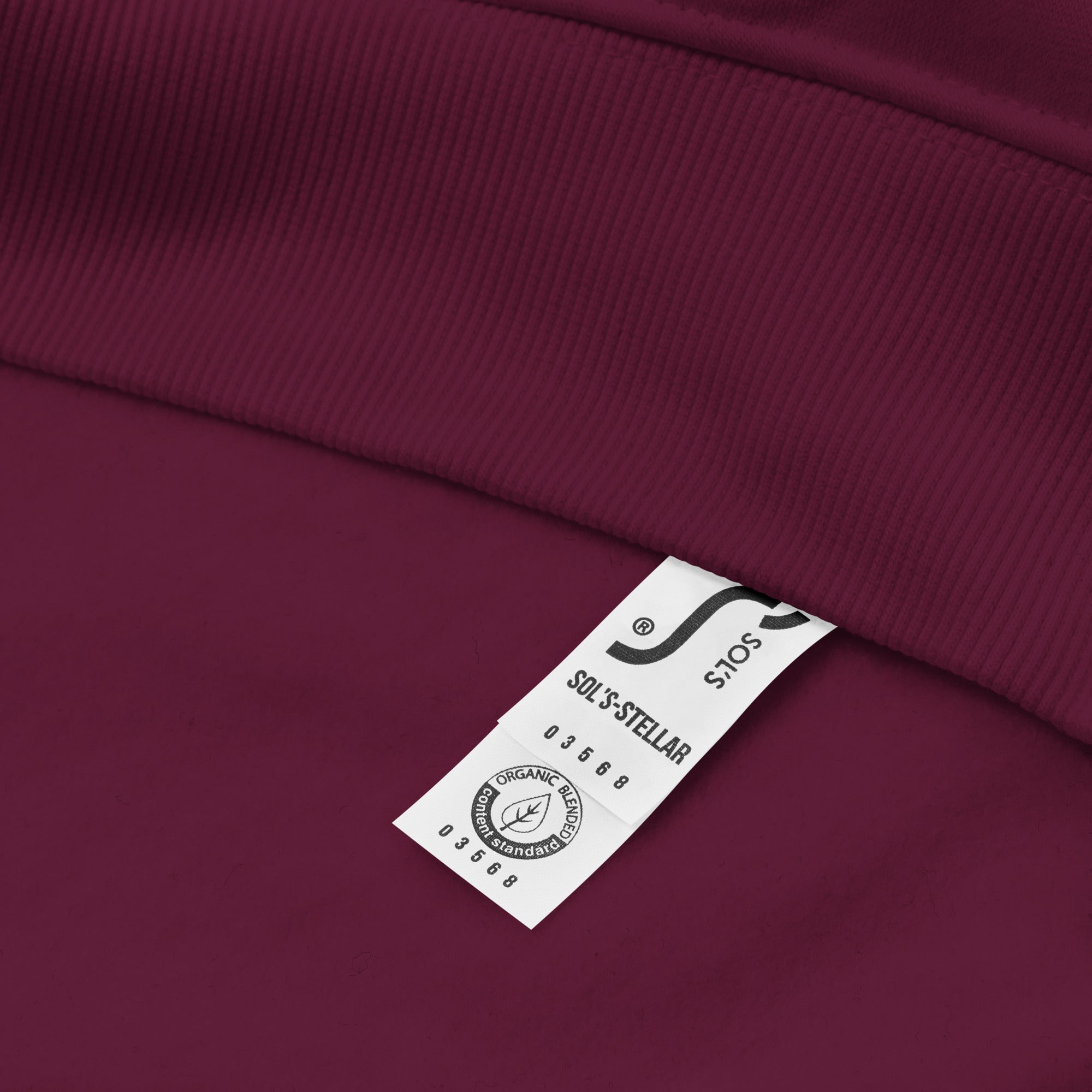 A close-up of The Geneva Visionary Hoodie certified material tag.