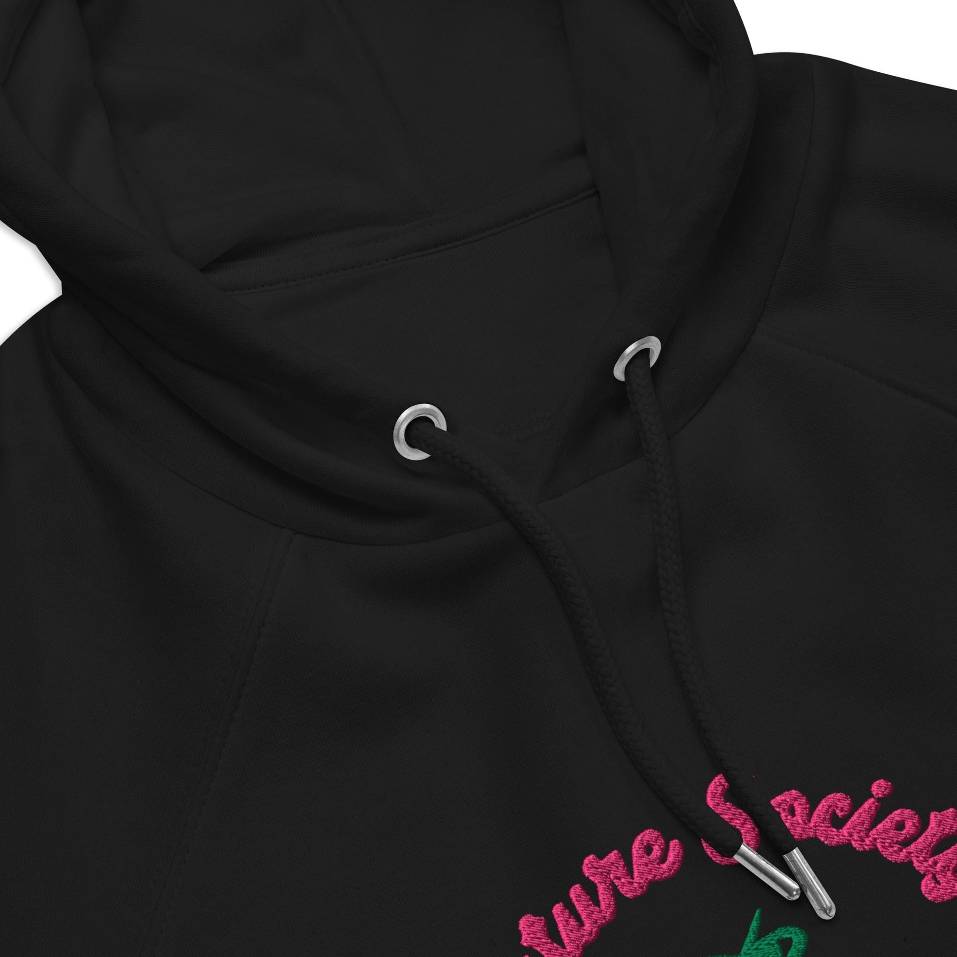 A close-up of The Geneva Visionary Hoodie embroidery, showing the green and blue "Future Society" text and green thunder symbol above the heart logo.