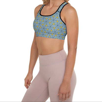 Model wearing the Geneva Performance Bra featuring a pattern of interweaved blue lines in yellow background.
