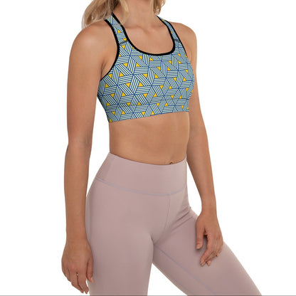 Model wearing the Geneva Performance Bra featuring a pattern of interweaved blue lines in yellow background.