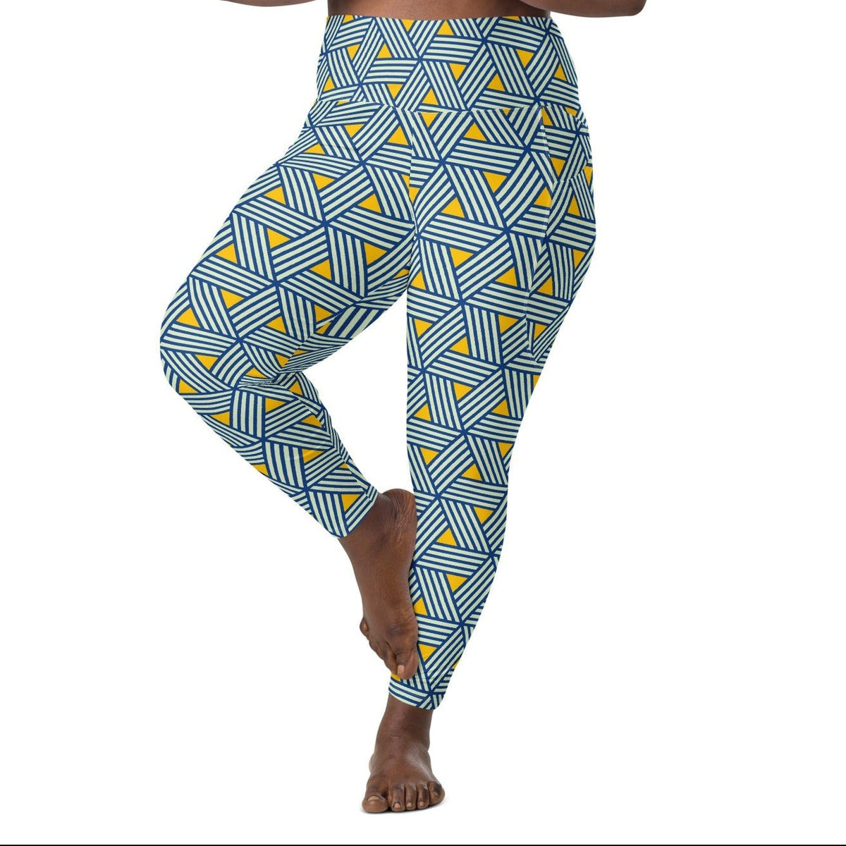model wearing the Geneva Sculpt Leggings featuring a pattern of interweaved blue lines in yellow background.