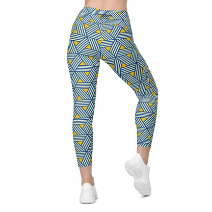 model wearing the Geneva Sculpt Leggings featuring a pattern of interweaved blue lines in yellow background.