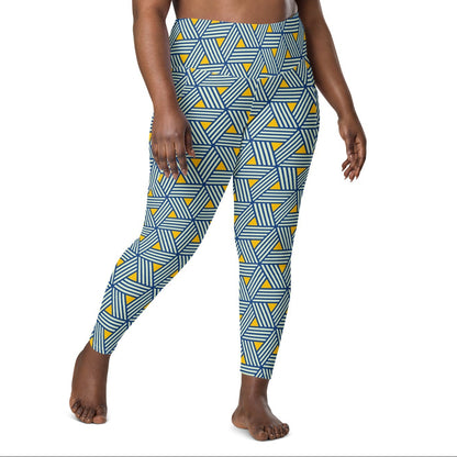 model wearing the Geneva Sculpt Leggings featuring a pattern of interweaved blue lines in yellow background.