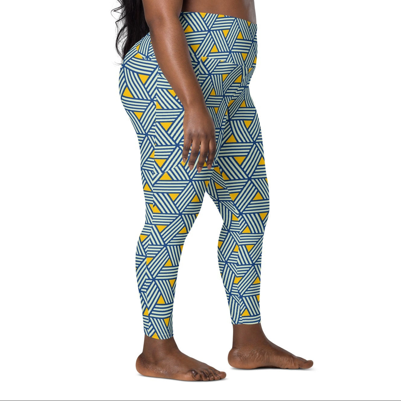 model wearing the Geneva Sculpt Leggings featuring a pattern of interweaved blue lines in yellow background.