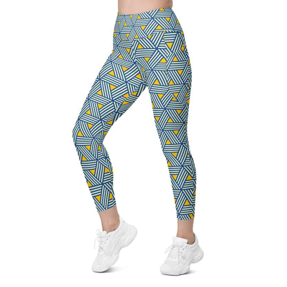 model wearing the Geneva Sculpt Leggings featuring a pattern of interweaved blue lines in yellow background.