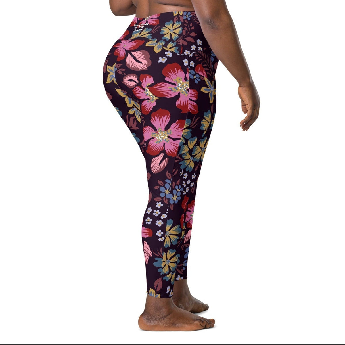 model wearing the Green Park  sculpt leggings in blue, pink, yellow floral pattern on burgundy background