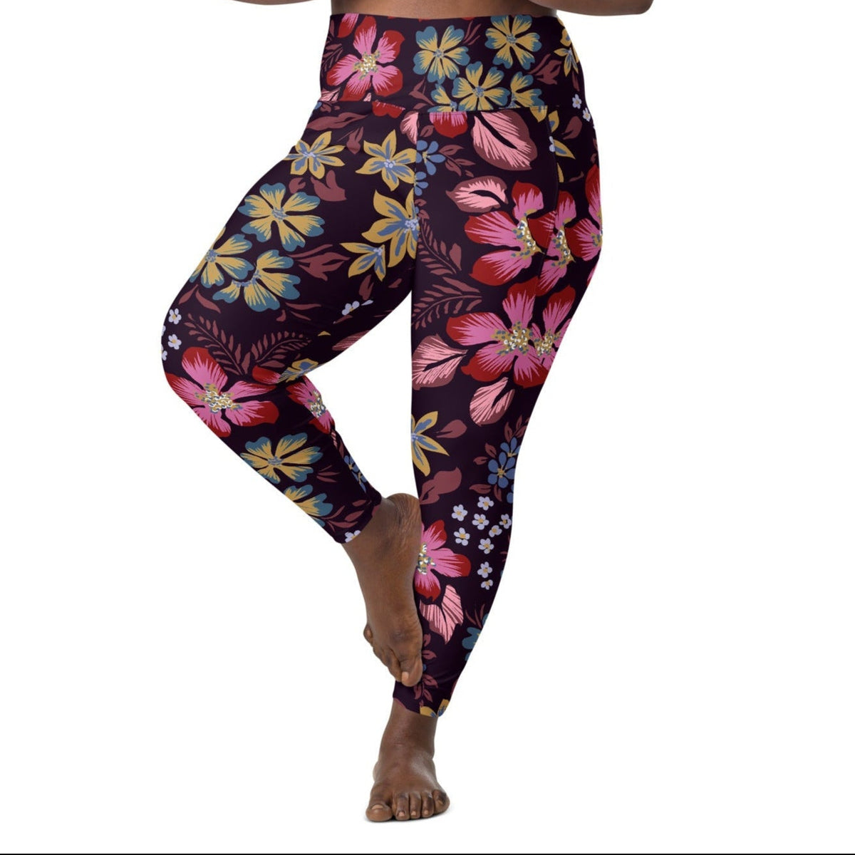 model wearing the Green Park  sculpt leggings in blue, pink, yellow floral pattern on burgundy background