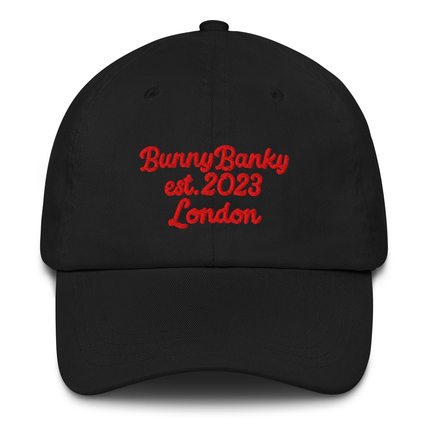 A close up of The Heritage Cap in black showing the heritage branded signature embroidered in red