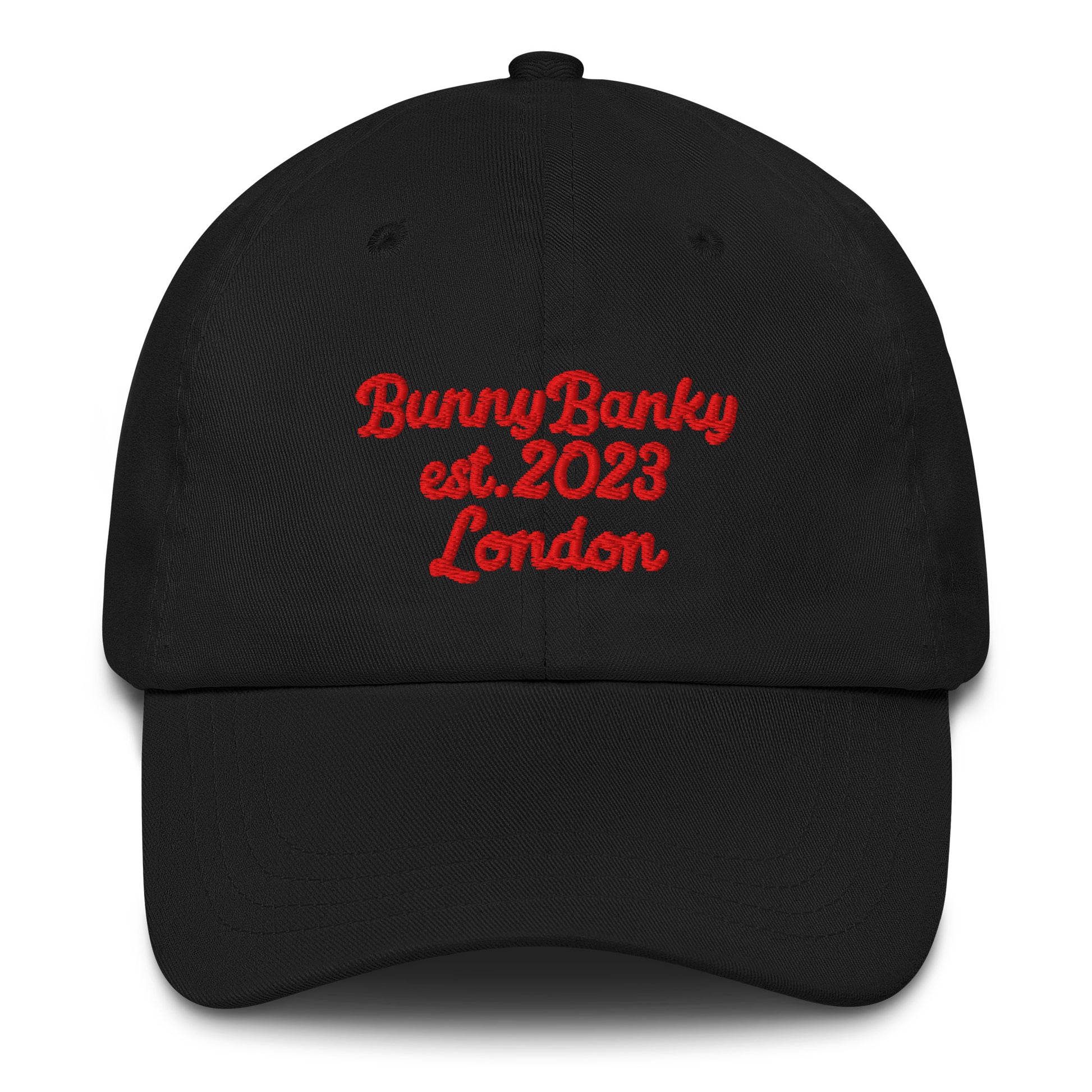 A close up of The Heritage Cap in black showing the heritage branded signature embroidered in red