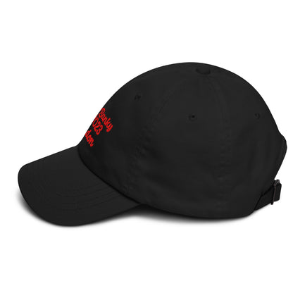 A close up of The Heritage Cap in black showing the heritage branded signature embroidered in red