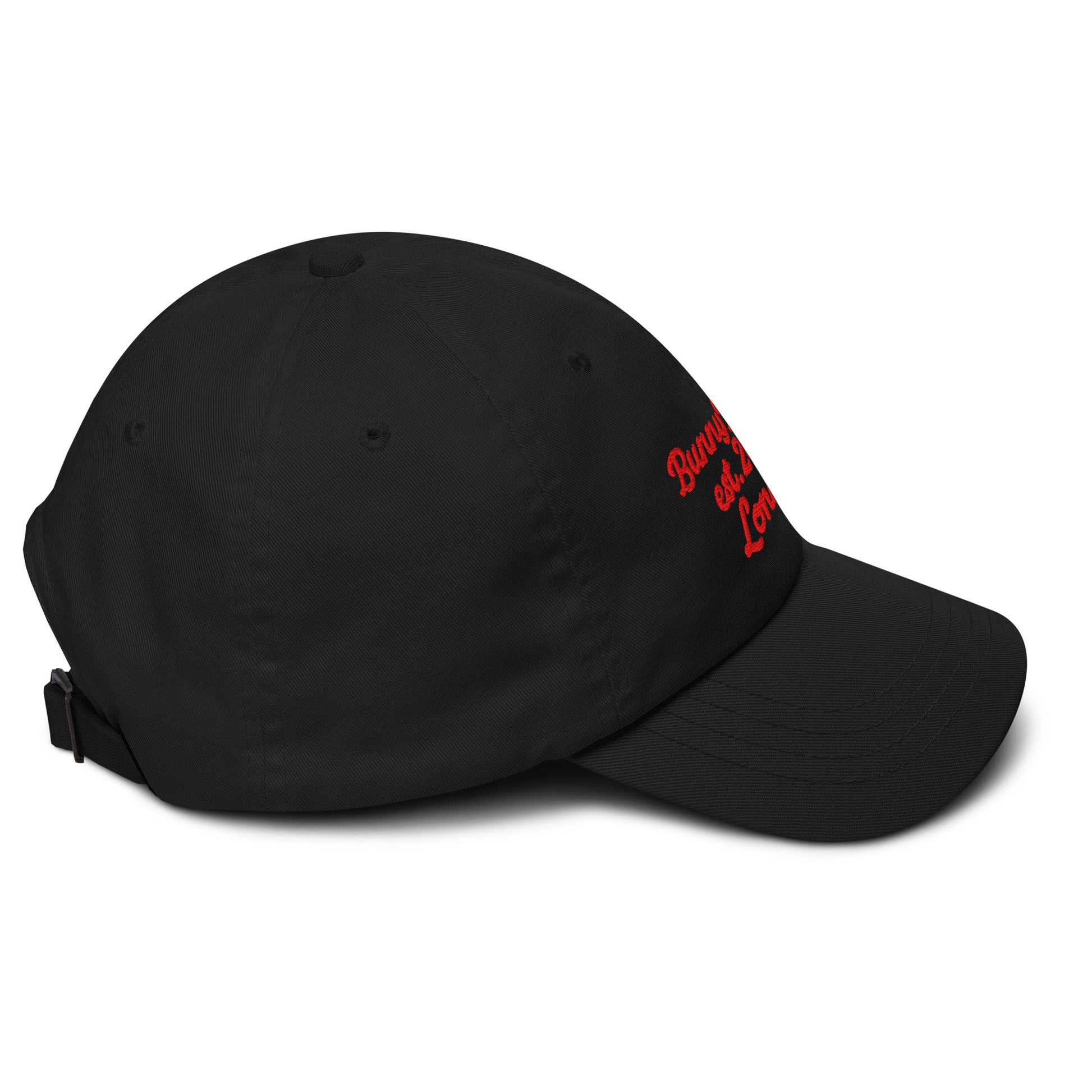 A close up of The Heritage Cap in black showing the heritage branded signature embroidered in red