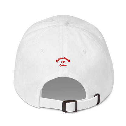 A close up of The Heritage Cap in white showing the heritage branded signature embroidered in red