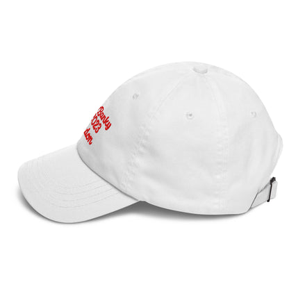A close up of The Heritage Cap in white showing the heritage branded signature embroidered in red