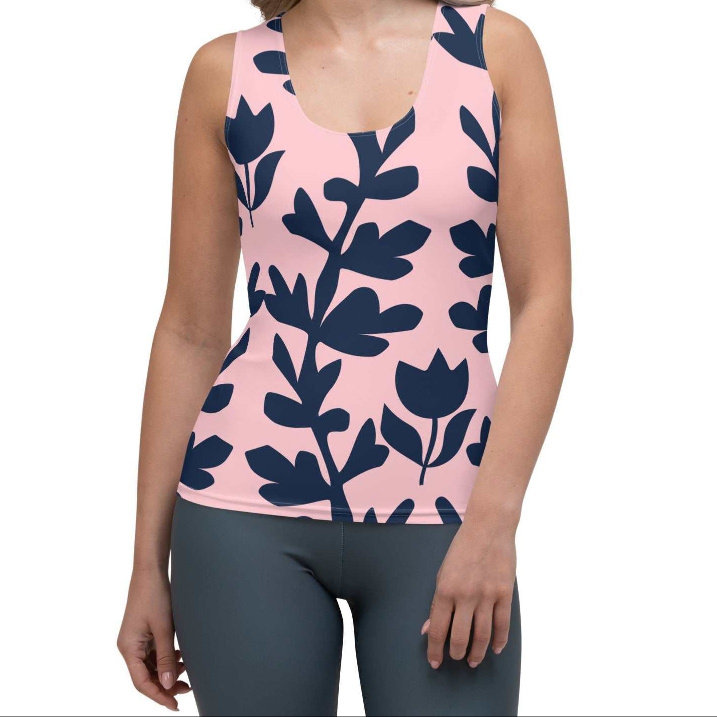 Model wearing the Kensington Performance Tank featuring navy blue floral pattern on soft pink fabric