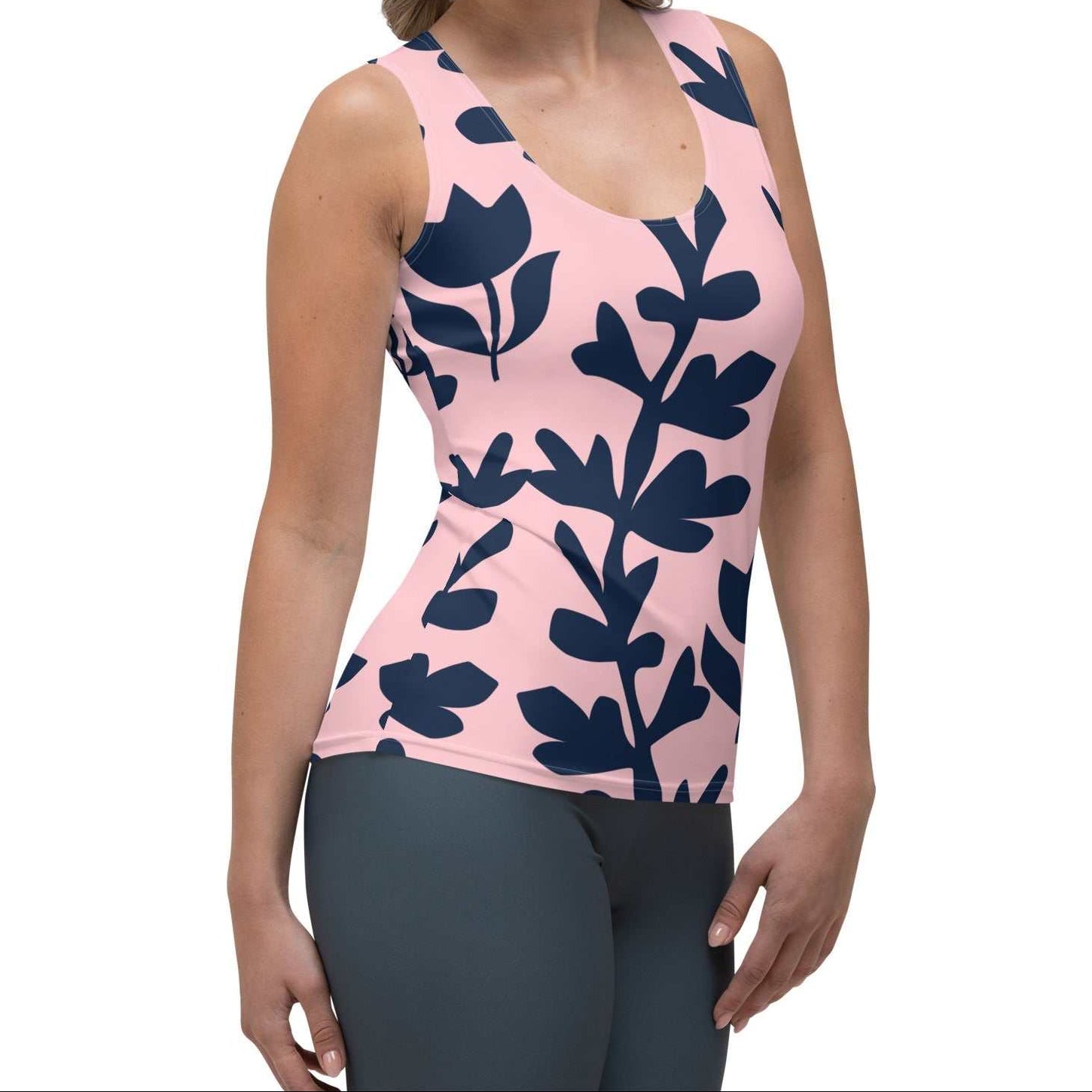 Model wearing the Kensington Performance Tank featuring navy blue floral pattern on soft pink fabric.