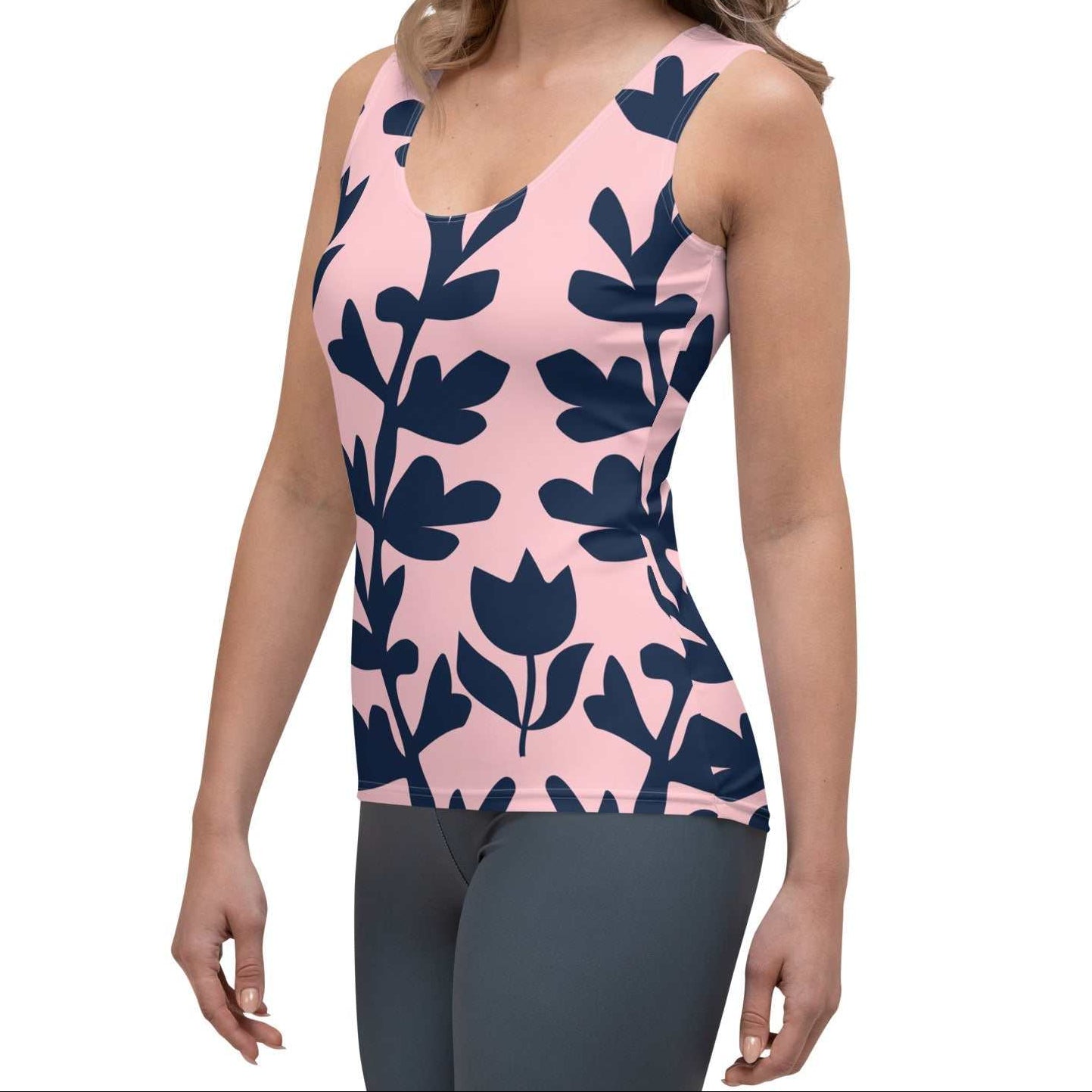 Model wearing the Kensington Performance Tank featuring navy blue floral pattern on soft pink fabric.