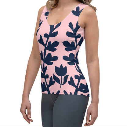 Model wearing the Kensington Performance Tank featuring navy blue floral pattern on soft pink fabric.