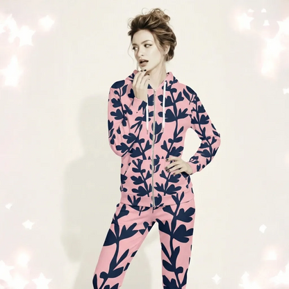 A BunnyBankY AI proprietary model wearing The Kensington Zip Hoodie, showing the full-zip closure and the oversized pink and blue floral print across the recycled polyester fabric.