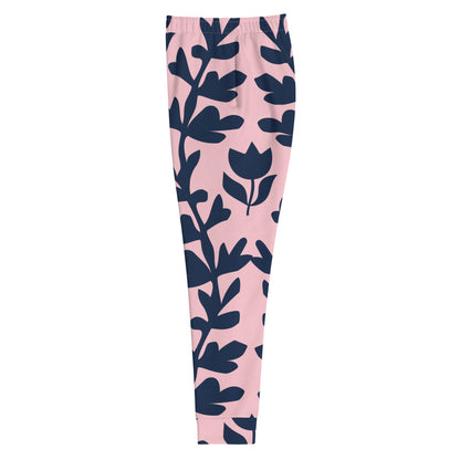 A close up of  The Kensington Glide Joggers, showing the slim fit and the bold, high-contrast pink and blue oversized floral print.