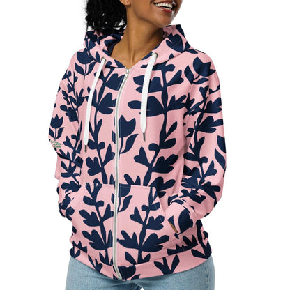 A model wearing The Kensington Zip Hoodie, showing the full-zip closure and the oversized pink and blue floral print across the recycled polyester fabric.