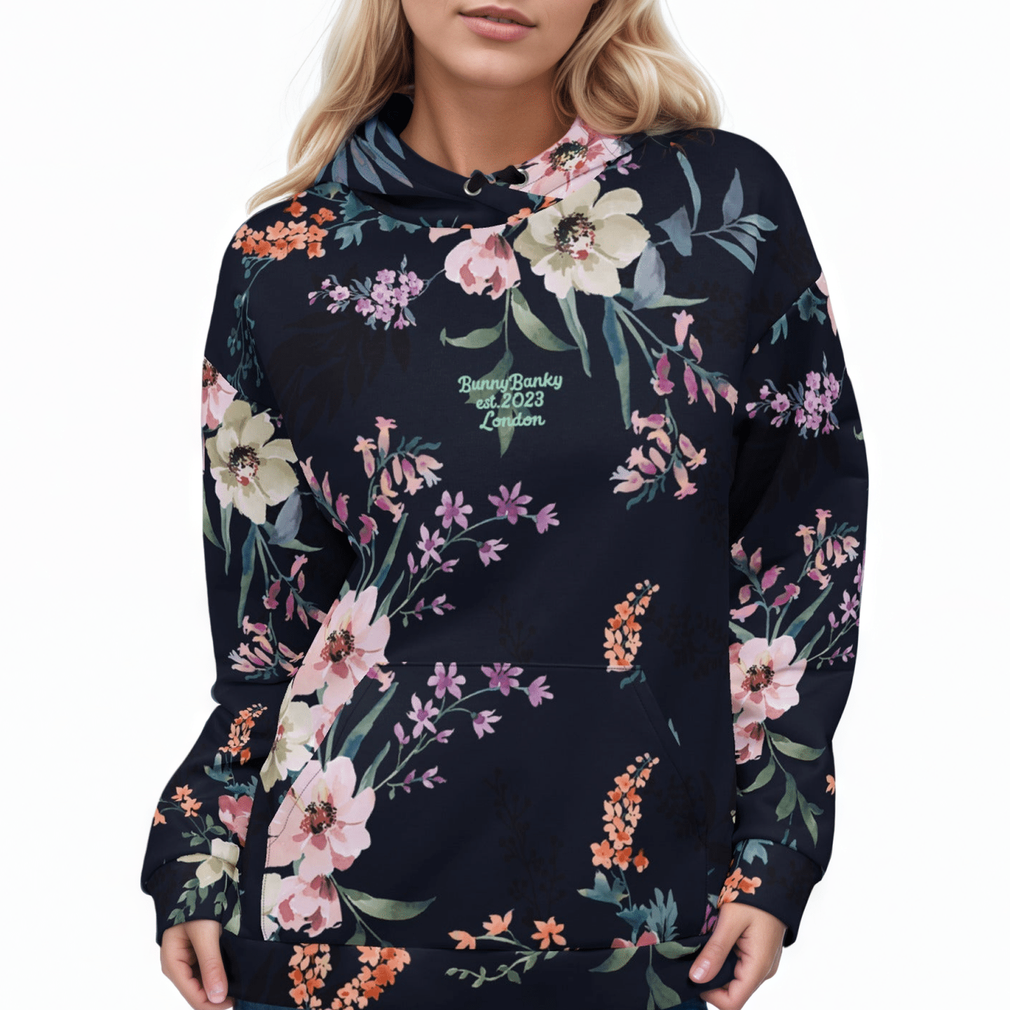 A BunnyBankY AI proprietary model wearing the Kew Botanical Hoodie, highlighting the vibrant pink and violet floral details and the soft, premium drape of the recycled fabric.