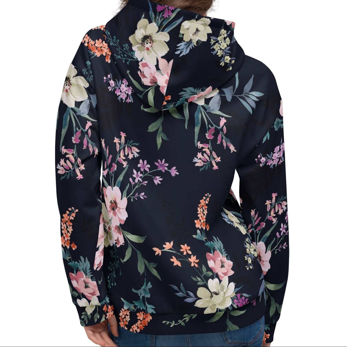 A model wearing the Kew Botanical Hoodie, highlighting the vibrant pink and violet floral details and the soft, premium drape of the recycled fabric.