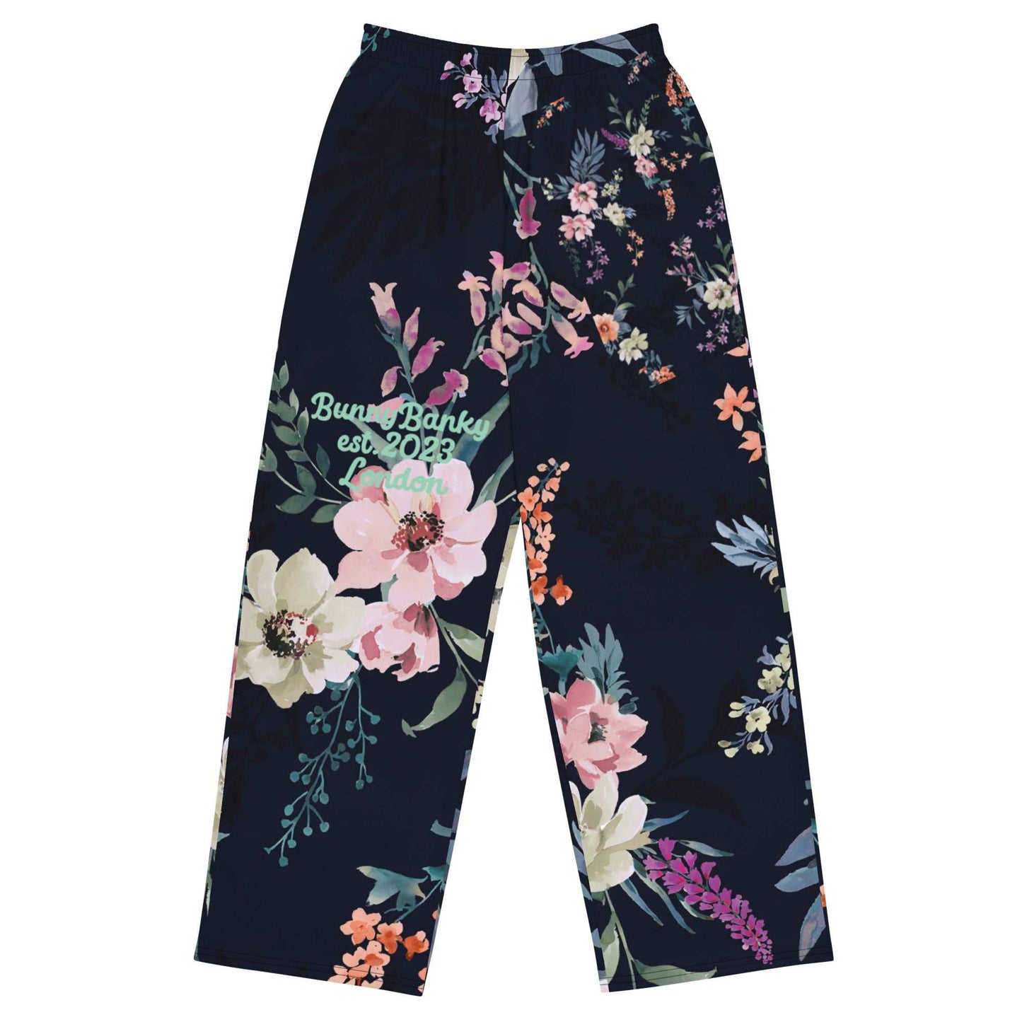 A close up of the Kew Botanical Wide Leg Joggers. The image highlights the cohesive floral print across joggers, emphasizing the premium drape of the wide-leg cut.