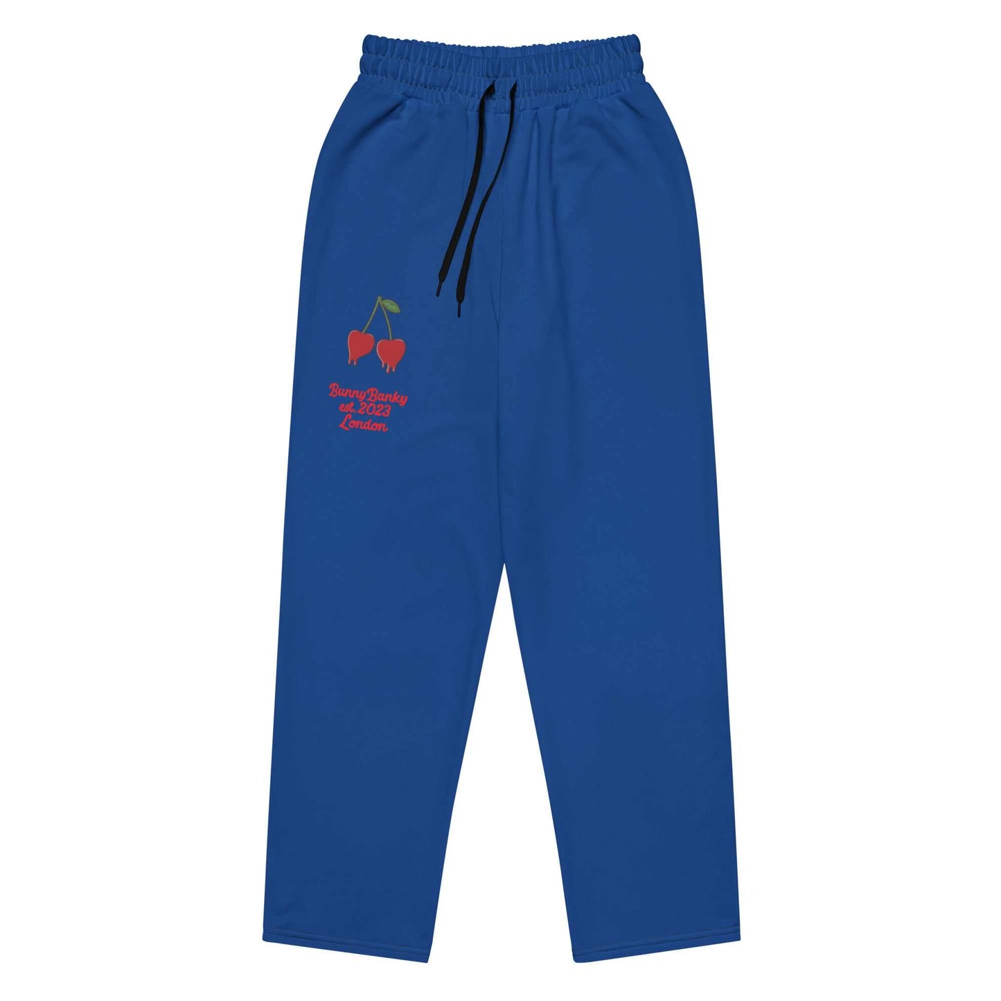 A close-up of The LA Navy Flow  Joggers, highlighting the playful Pop Cherry print and the heritage logo and the binary code print (1s and 0s) on the back left leg.