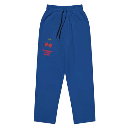 A close-up of The LA Navy Flow  Joggers, highlighting the playful Pop Cherry print and the heritage logo and the binary code print (1s and 0s) on the back left leg.
