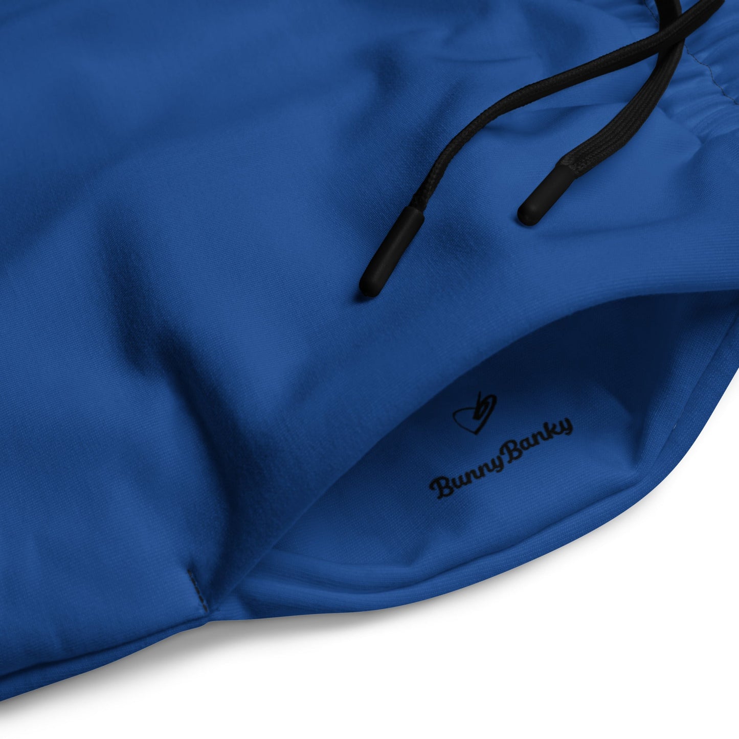 A close-up of The LA Navy Flow Wide Joggers, highlighting the playful Pop Cherry print and the heritage logo. 