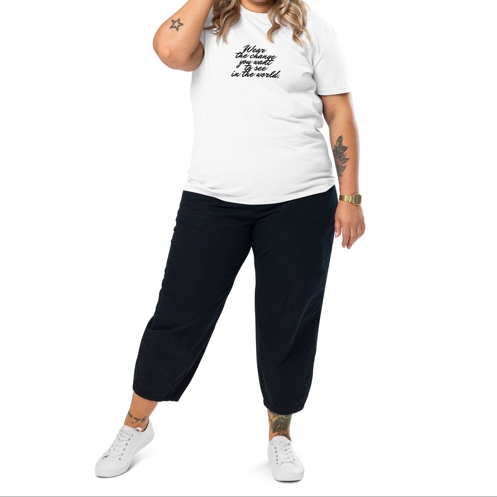 A model wearing The Manifesto Tee in 100% organic cotton, showing the 