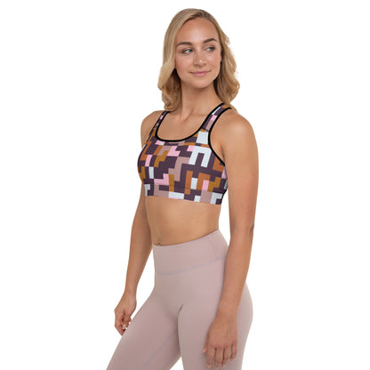 A model wearing The Marais Digital Atelier Performance Bra, showing the supportive fit and the sophisticated Cubism-inspired geometric print in pink, brown, and white.