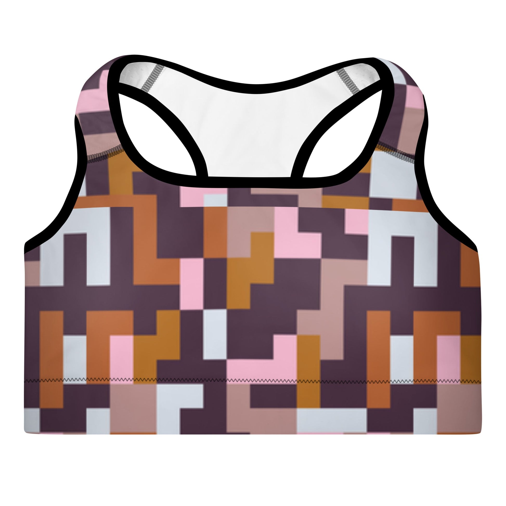 A close up of The Marais Performance Bra, showing the supportive fit and the sophisticated Cubism-inspired geometric print in pink, brown, and white.