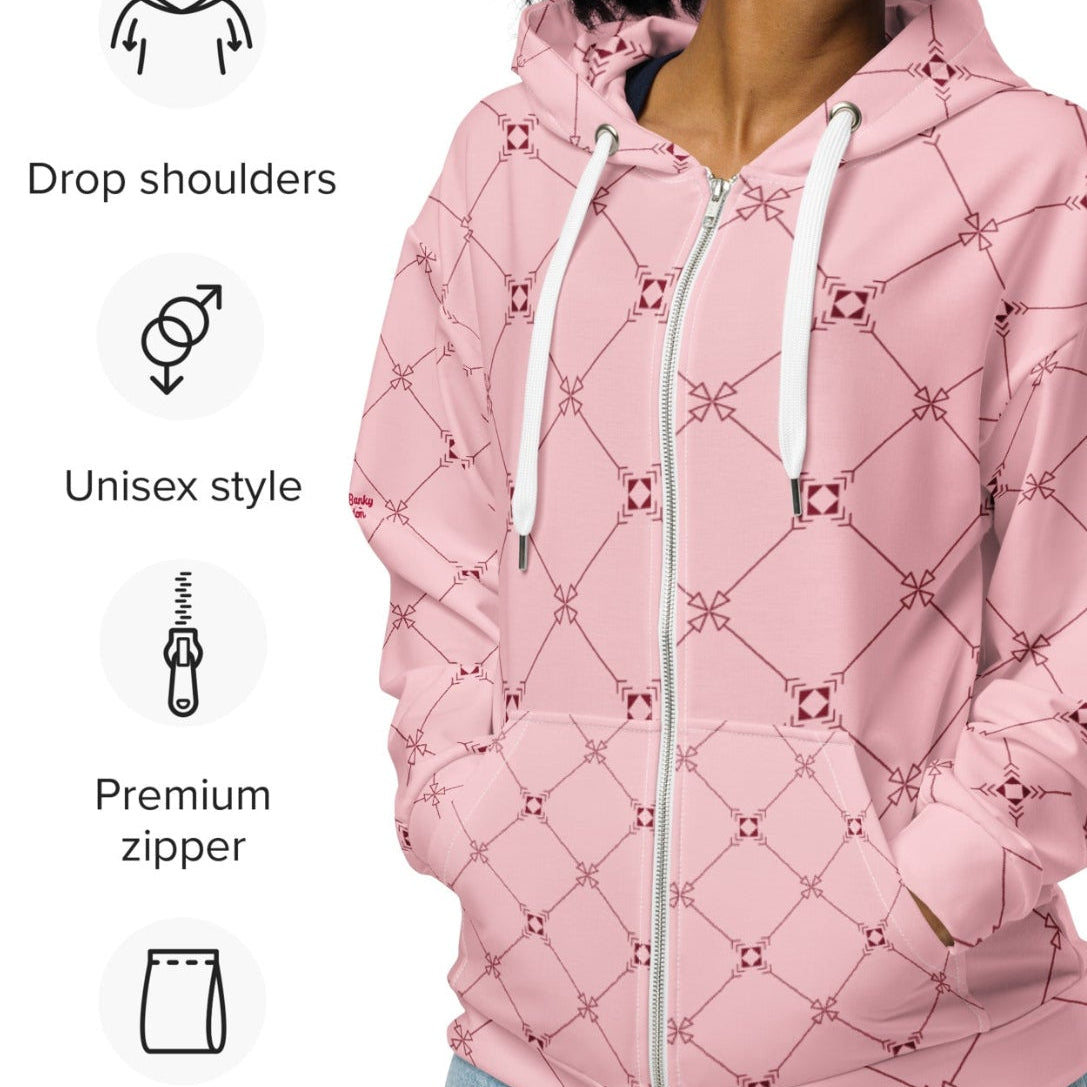 A model wearing the Mayfair  Zip Hoodie, showing the unisex fit and the sophisticated burgundy and pink geometric monogram print.