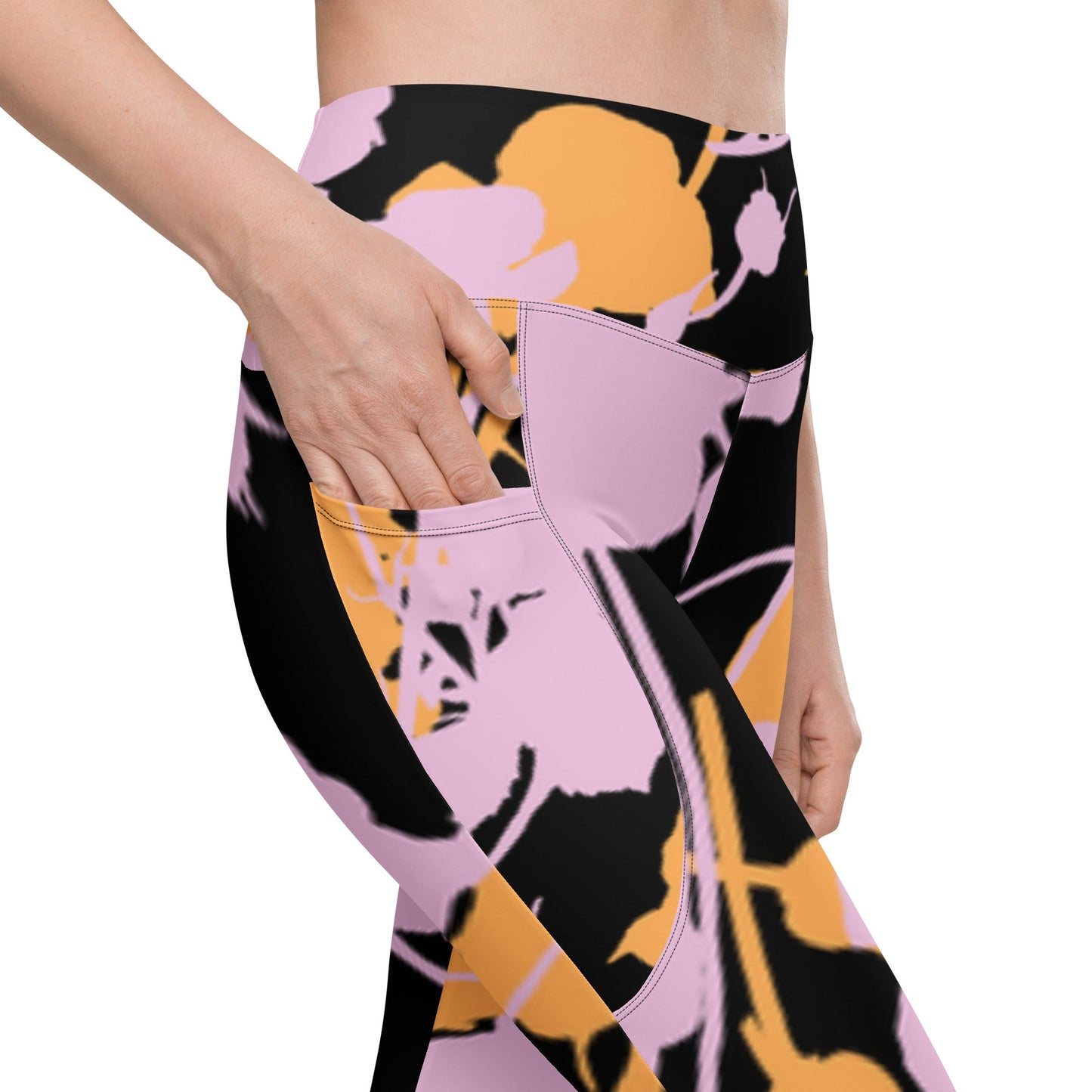 A model wearing The Miami Sculpt Leggings, showing the sculpting fit and the dynamic pink and orange splashes print on the black fabric.