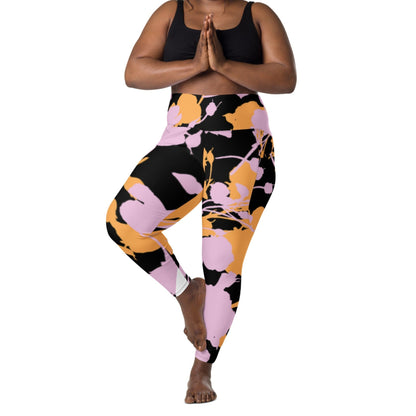 A model wearing The Miami Sculpt Leggings, showing the sculpting fit and the dynamic pink and orange splashes print on the black fabric.